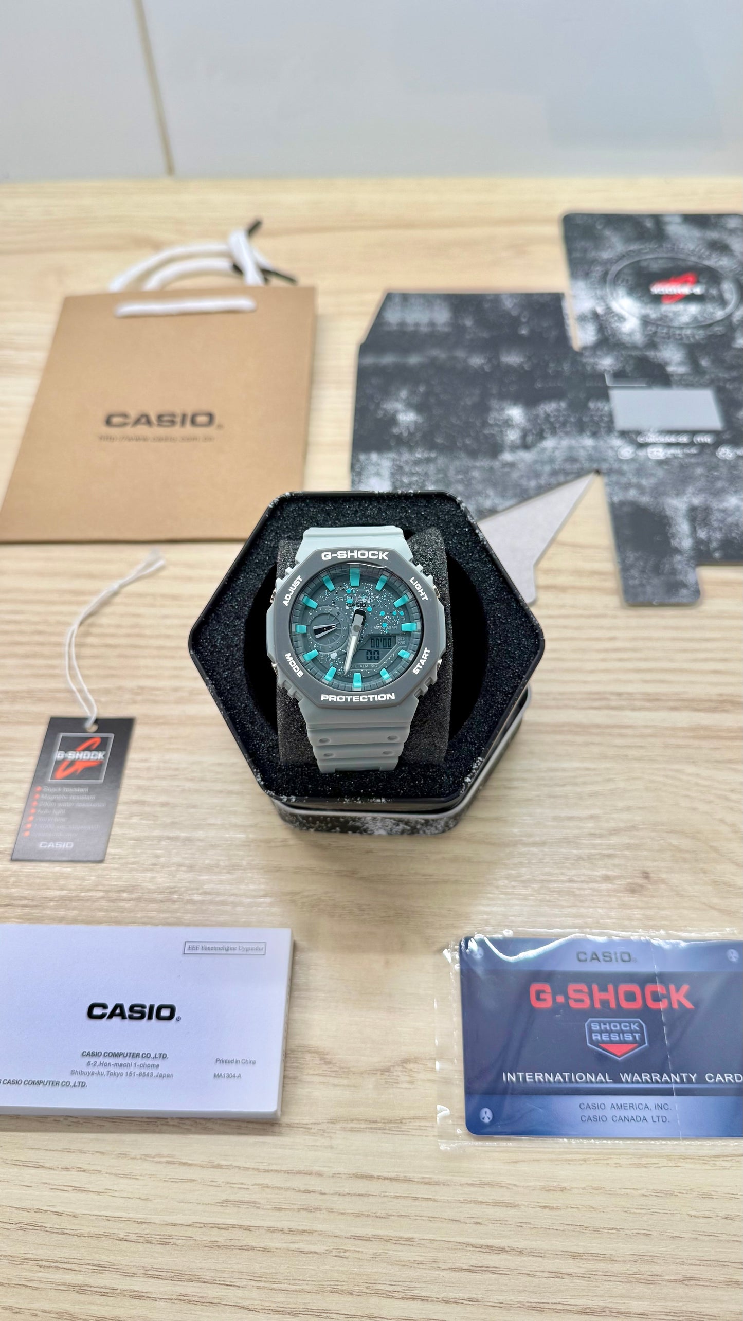 G shock grise bleue