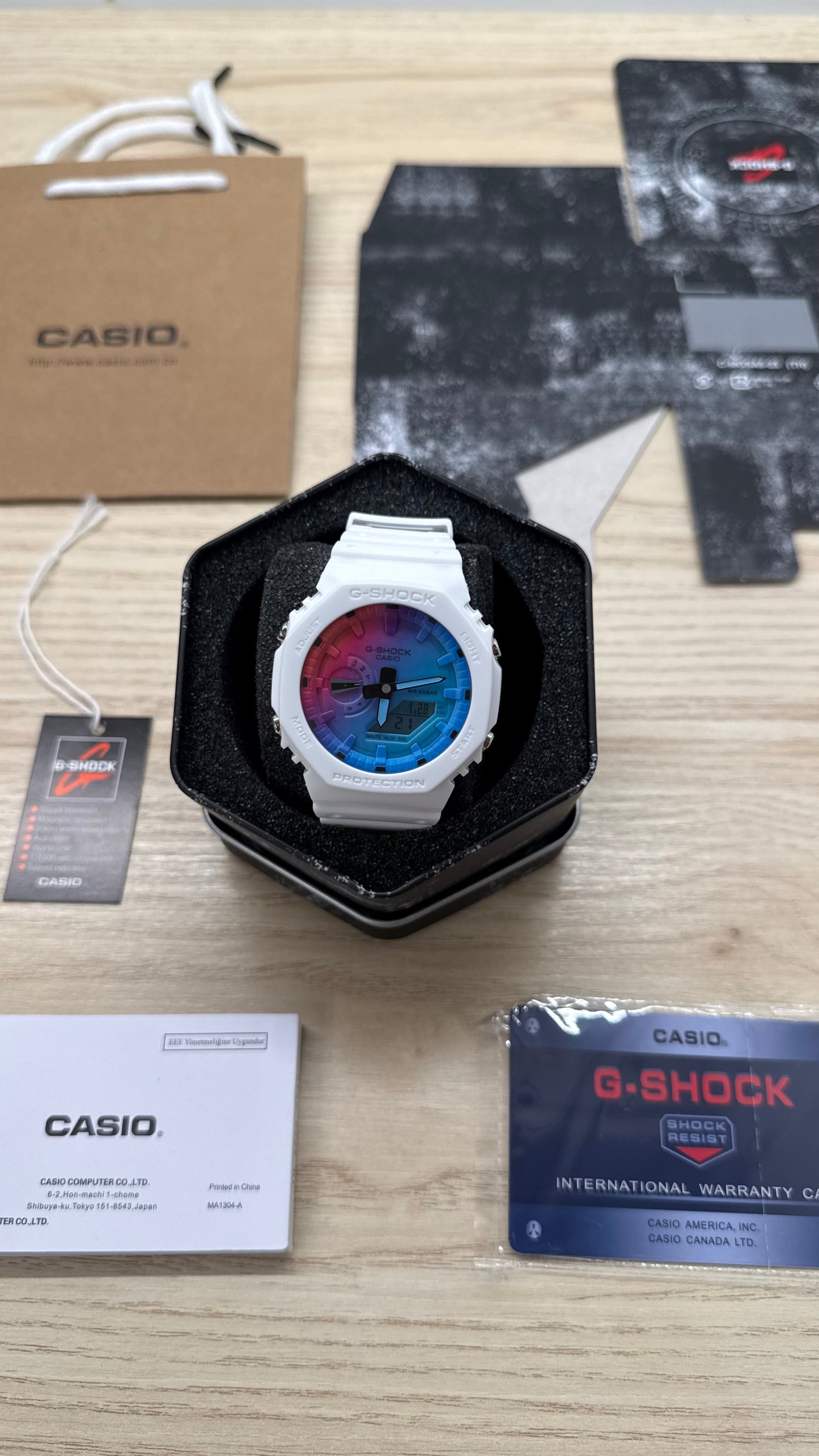 G shock blanche multicolore