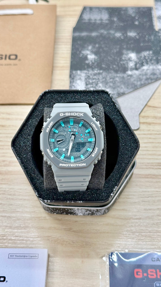 G shock grise bleue